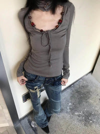Japanese Y2K Distressed Cross Skinny Flared Jeans — dettaglio del tessuto