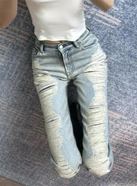 Ultra Distressed Y2K Skinny Flare Low Waisted Jeans — dettaglio della stampa