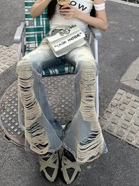 Ultra Distressed Y2K Skinny Flare Low Waisted Jeans — in alternativa