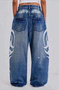 Vintage Y2K Ripped Tribal Graphic Baggy Jeans — dettaglio