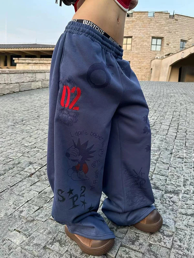 Baggy Blue Graphic Sweatpants Joggers Trousers — vista frontale