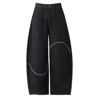 Curved Chain Graphic Barrel Denim Jeans — dettaglio del tessuto