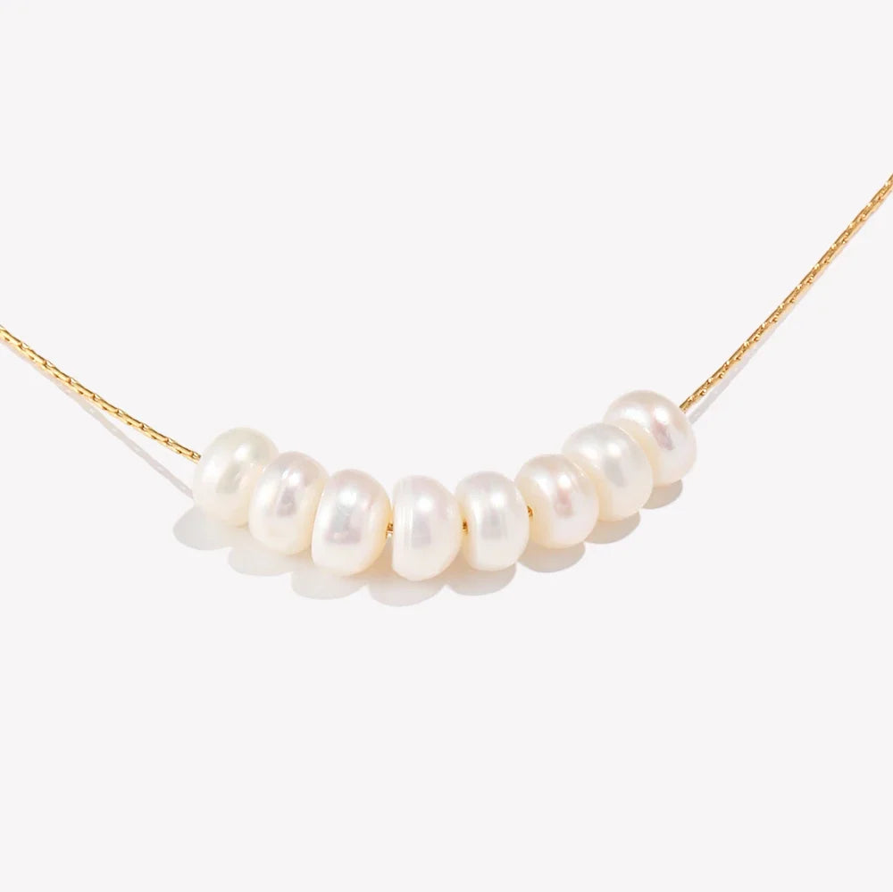 Dainty Pearl Charm Necklace — dettaglio della stampa
