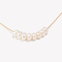 Dainty Pearl Charm Necklace — dettaglio della stampa
