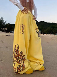Graphic Wide Leg Yellow Sweatpants Joggers Trousers — vista frontale