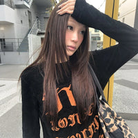 Orange And Black Graphic Long Sleeve Top — dettaglio della stampa