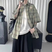 Oversized Plaid Short Sleeve Flannel Button Up Shirt — dettaglio del tessuto