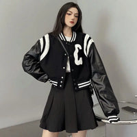 Patchwork PU Leather Black Varsity Jacket — vista laterale
