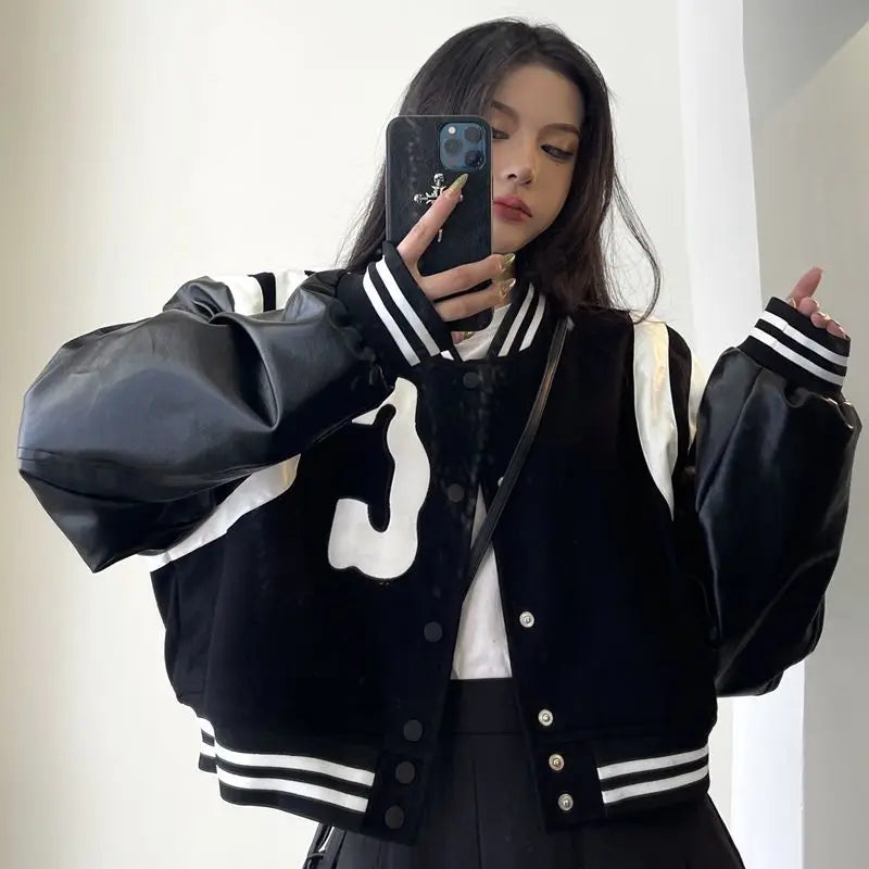 Patchwork PU Leather Black Varsity Jacket — vista posteriore