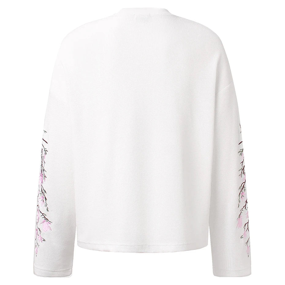 Pink Flower Embroidered Sleeves Long Sleeve Top — dettaglio della stampa